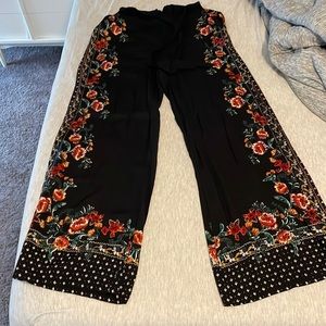 Black with floral flare dress pant. Size M